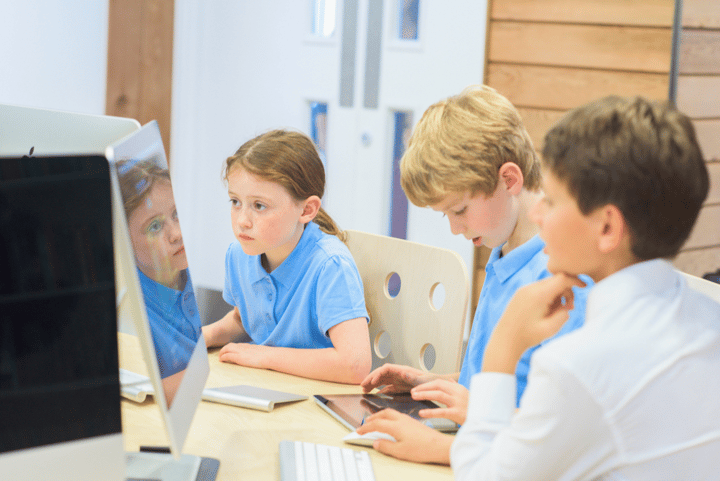 Pupils using devices in class